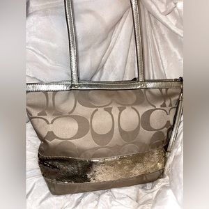 Coach purse with gold sequined accent.